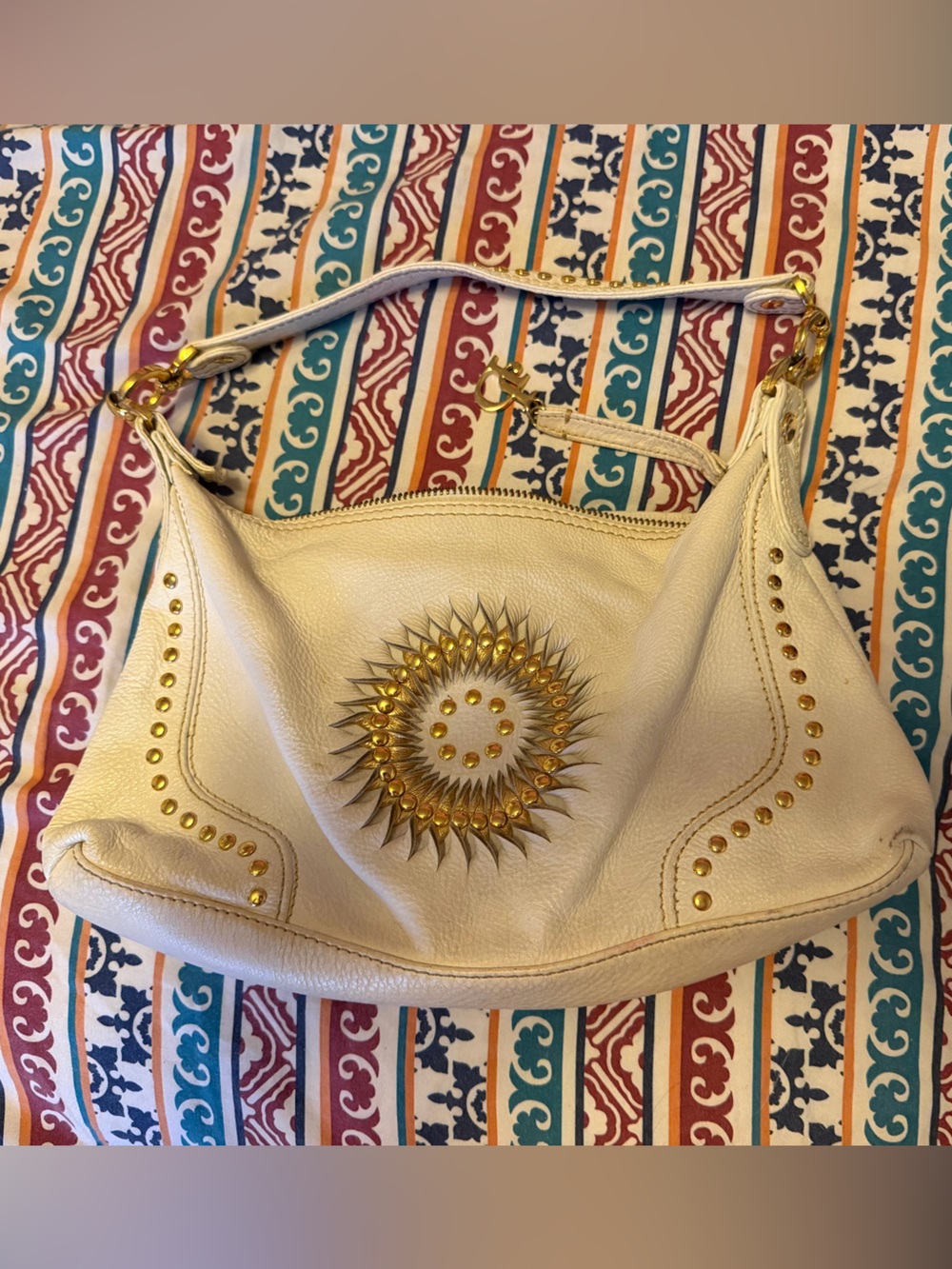 Cream Leather Shoulder Bag with Gold Sunburst Accent